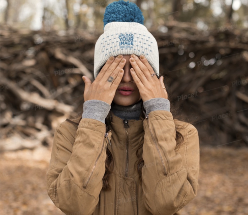 beanie mockup featuring a woman with a tattoo on her finger
