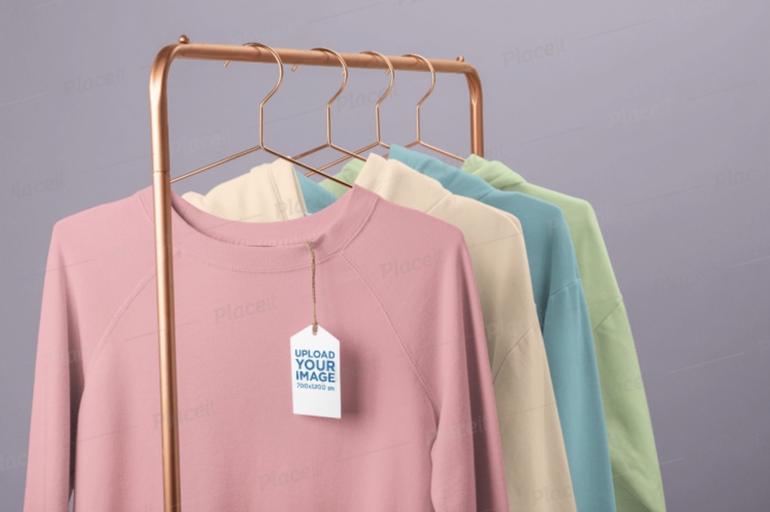 clothing tag mockup featuring a rack of crewneck sweatshirts