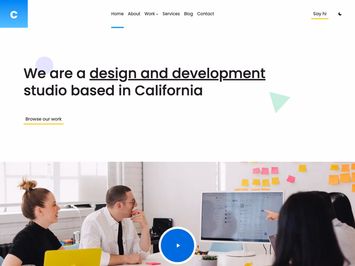 Creative Agency WordPress theme home page, with the studio's opening statement above a photograph of the team and a play button