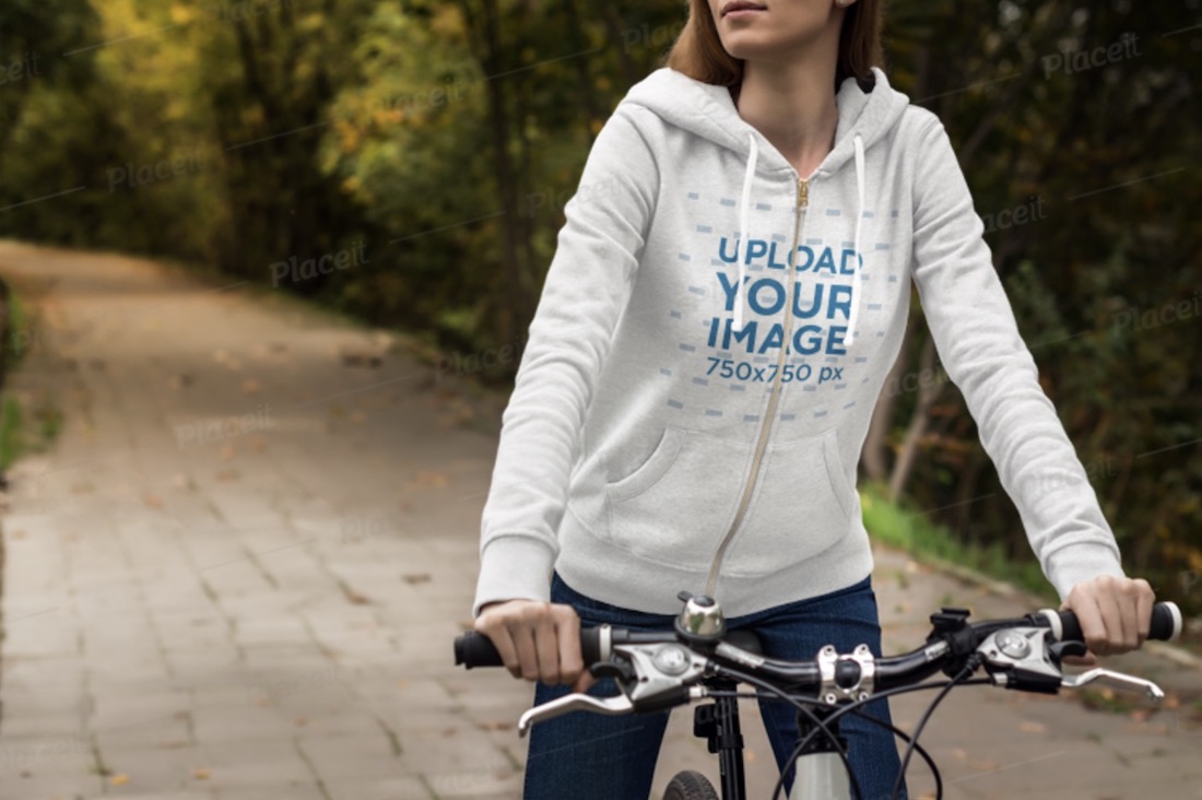 heather hoodie mockup of a woman riding a bicycle