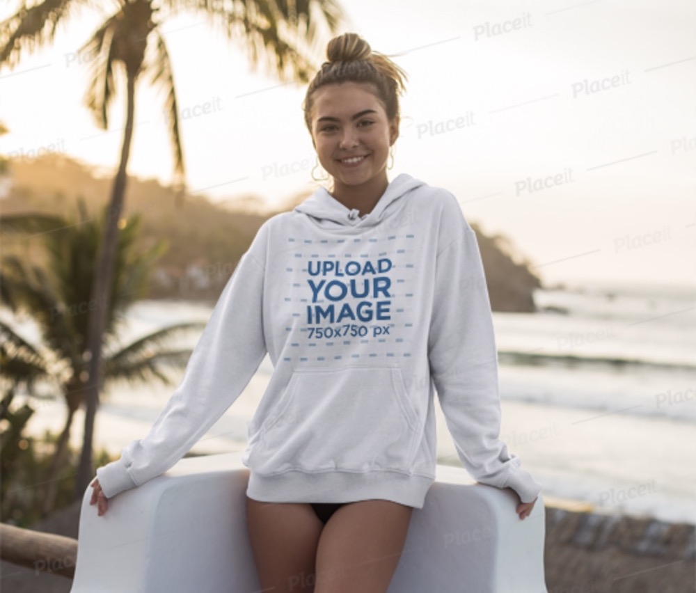 hoodie mockup of a woman posing at sunset