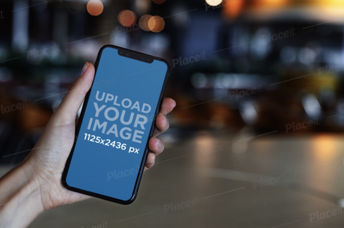 iphone 11 pro mockup featuring blurred lights in the background
