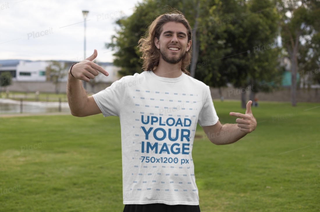 mockup featuring a young man in the park pointing at his white tee