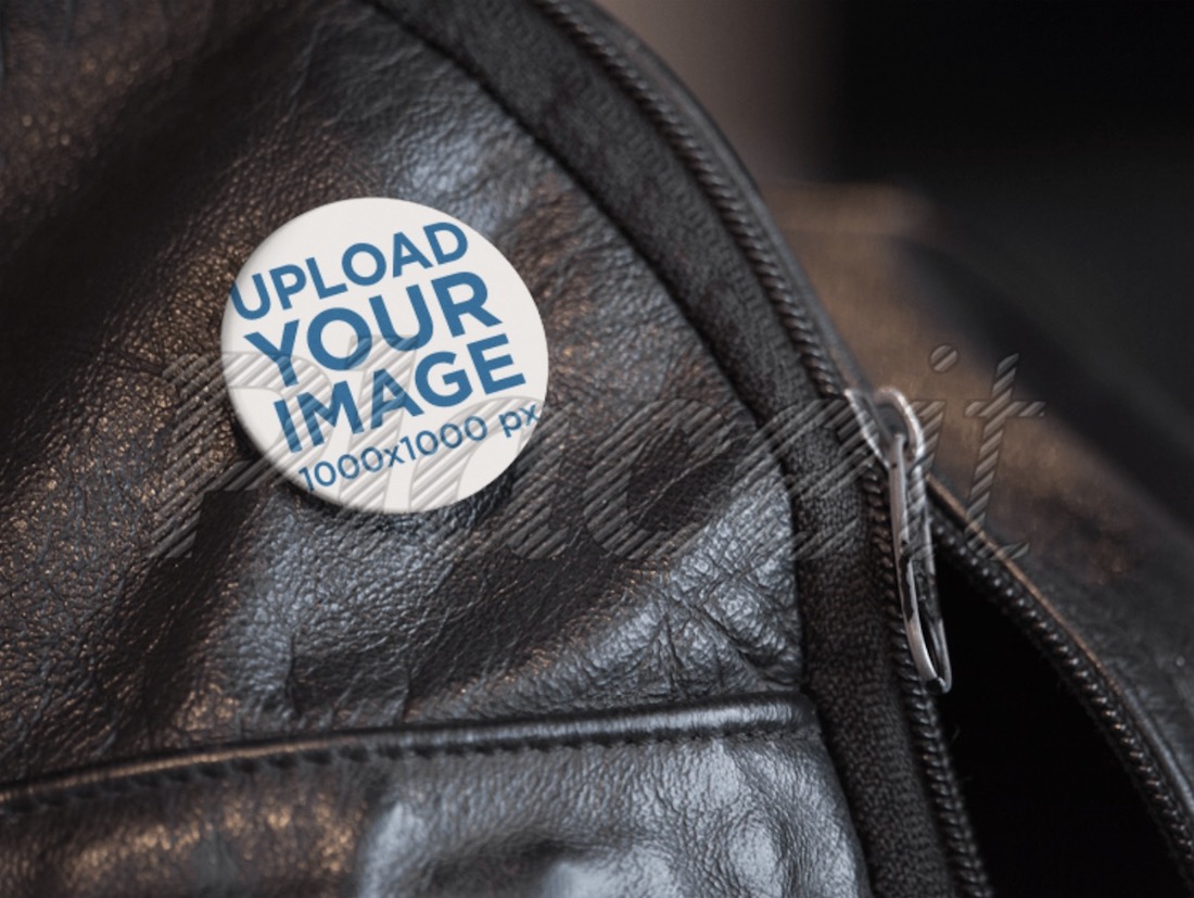 mockup of a button on a black leather backpack