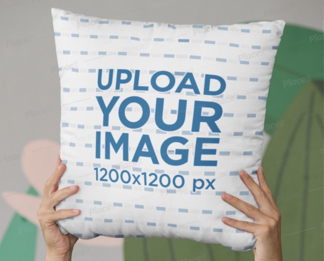 mockup of hands holding a square pillow