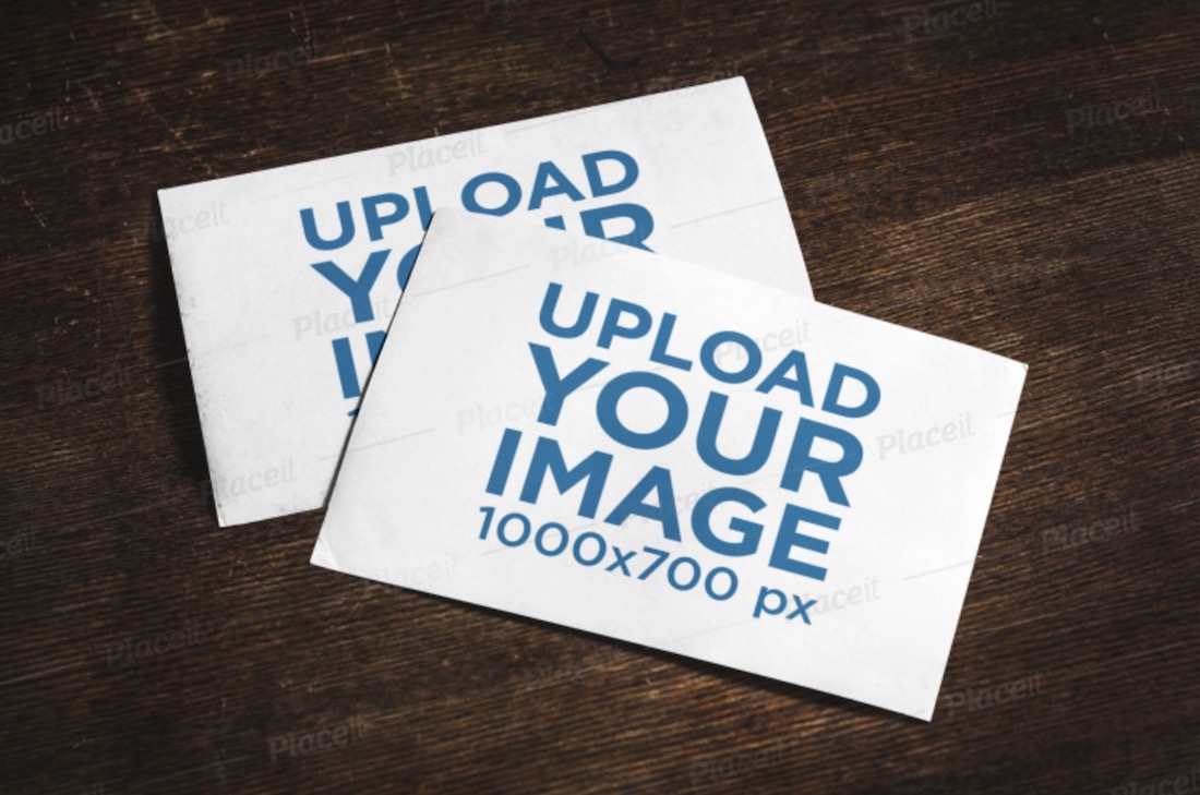 mockup of two postcards on a wooden surface