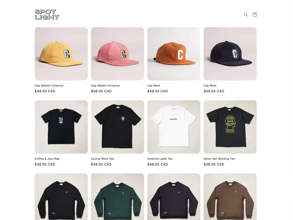 Spotlight free Shopify theme homepage with a caps and t-shirts product grid