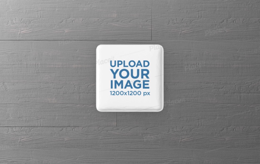 square pin button logo mockup featuring a grey wooden surface